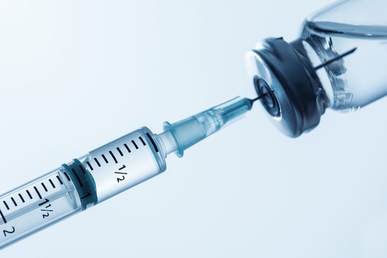 Syringe being filled